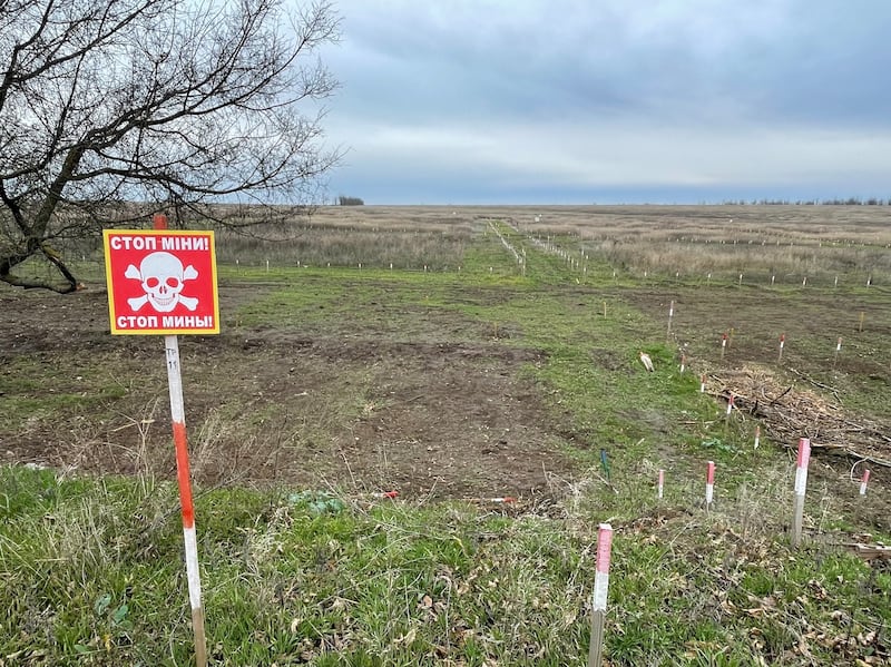 A minefield warning near Snihurivka in southeastern Ukraine. An estimated 139,000 km2 of Ukrainian territory is contaminated with mines and other explosives - an area almost twice the size of Ireland. Photograph: Daniel McLaughlin