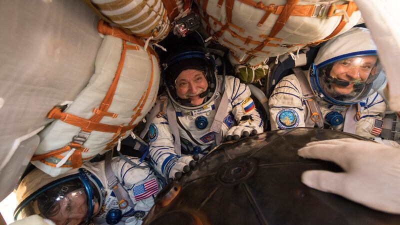 Expedition 52 Flight Engineer Peggy Whitson, Commander Fyodor Yurchikhin of Roscosmos  and Fight Engineer Jack Fischer of Nasa inside the Soyuz MS-04 spacecraft shortly after it landed near the town of Zhezkazgan, Kazakhstan
