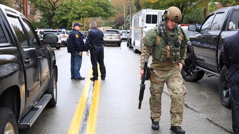 A Swat police officer and other first responders respond after a gunman opened fire at the Tree of Life synagogue in Pittsburgh, Pennsylvania, US. Photograph: John Altdorfer/Reuters