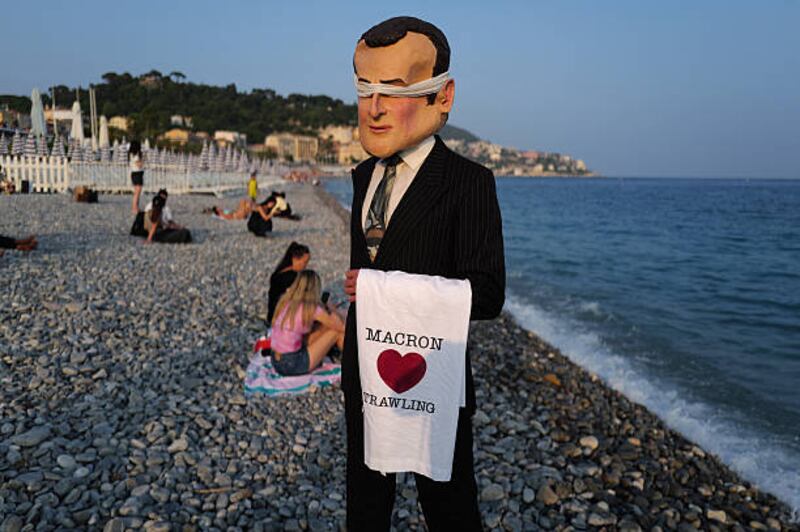 A member of the Ocean Rebellion activist group dressed as French president Emmanuel Macron  on the sidelines of the UN ocean conference in Nice. Photograph: Valery Hache/AFP via Getty Images