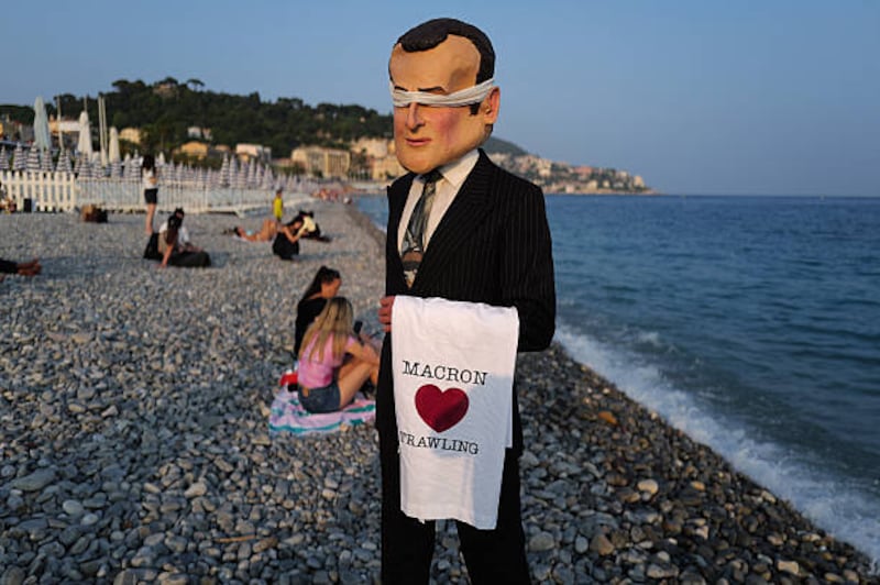 A member of the Ocean Rebellion activist group dressed as French president Emmanuel Macron on the sidelines of the UN ocean conference in Nice. Photograph: Valery Hache/AFP via Getty Images