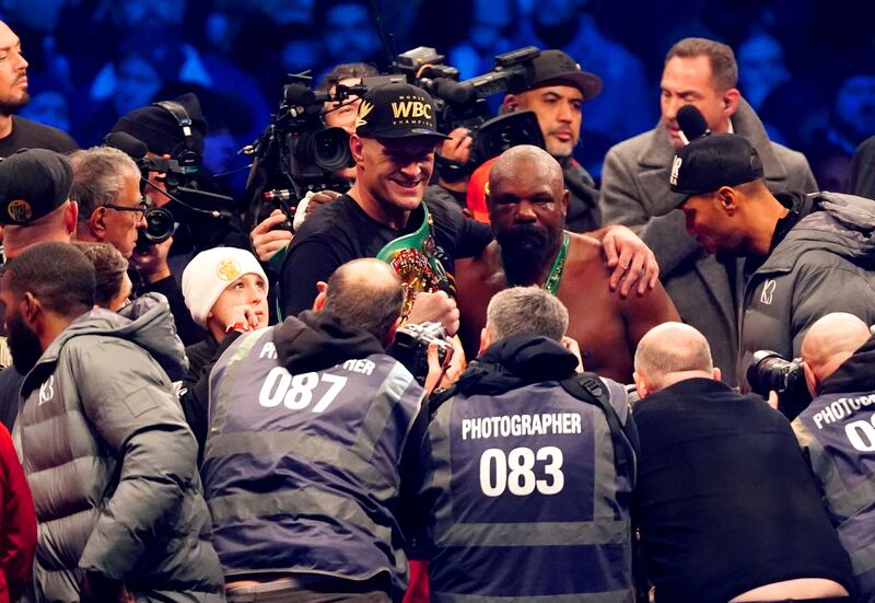 Tyson Fury poses for a photo with Derek Chisora after beating him in the 10th round. Photograph: Zac Goodwin/PA