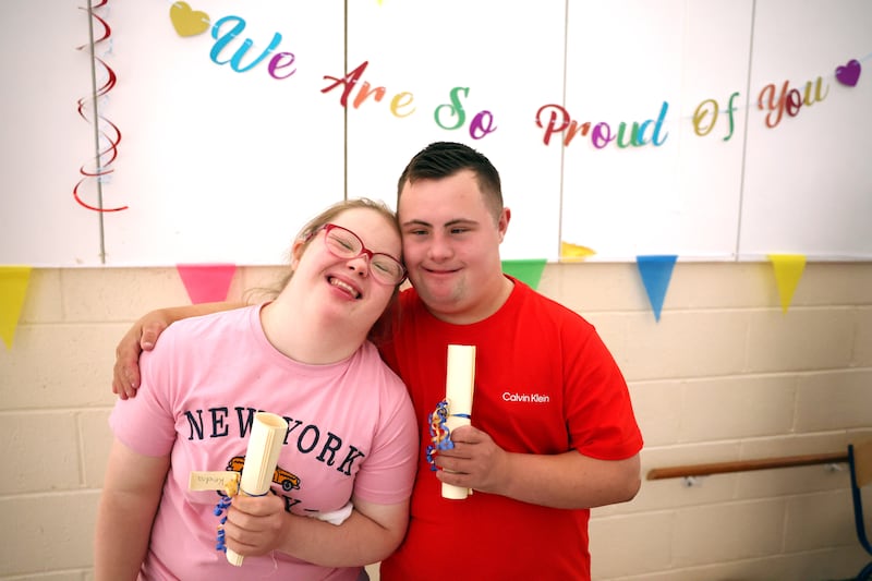 Kendra Hopkins (18) hugs her friend Leon McKenny (18), as they hold their Leaving Certificates. For the first time ever, students with special educational needs who have undertaken the L1 and L2 learning programme modules will get their results on the same day as other Leaving Certificate students at St. Catherine's Special School in Newcastle, County Wicklow. Photograph by Clodagh Kilcoyne/The Irish Times