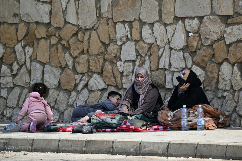 Displaced residents who fled Israeli airstrikes in Beirut's southern suburbs sit along the corniche waterfront in the Lebanese capital on Friday. Photograph: Joseph Eid/AFP via Getty