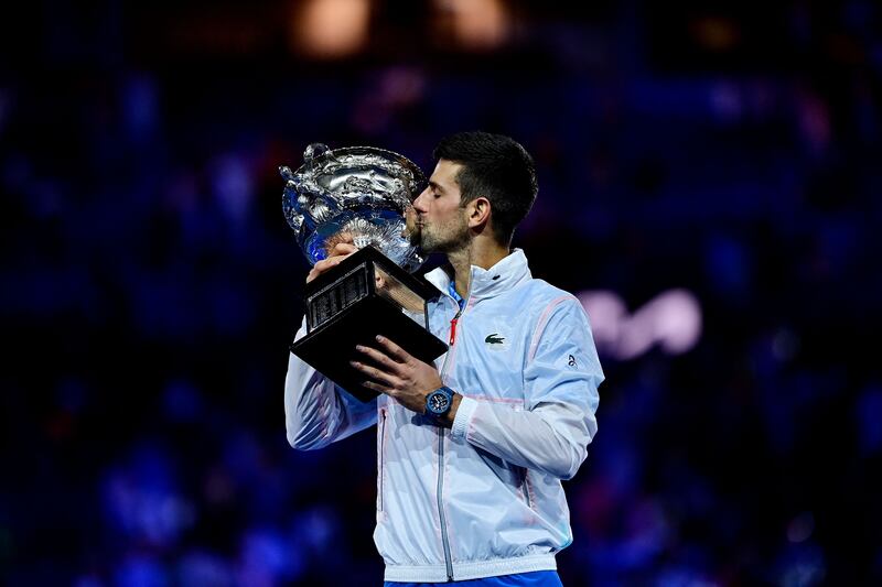 Serbia's Novak Djokovic kisses the Norman Brookes Challenge Cup trophy following his victory against Greece's Stefanos Tsitsipas. Photograph: Manan Vatsyayana/AFP via Getty Images 