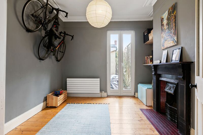 Playroom/dining room with hoisted bike stands