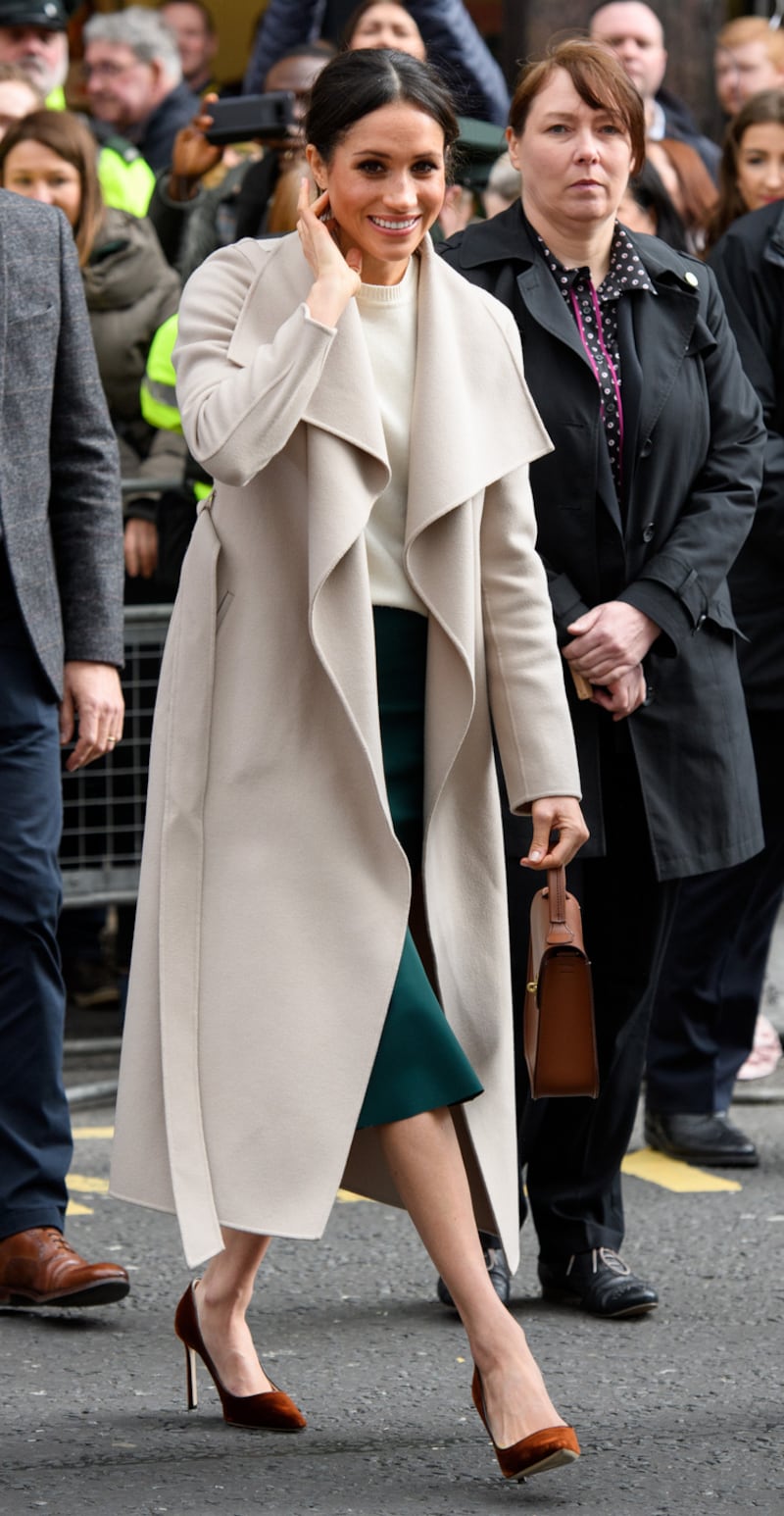 BELFAST, NORTHERN IRELAND - MARCH 23:  Meghan Markle and Prince Harry meet members of the public after visiting Crown Bar, a former Victorian gin palace owned by the National Trust, on March 23, 2018 in Belfast, Nothern Ireland.  (Photo by Tim Rooke - Pool/Getty Images)