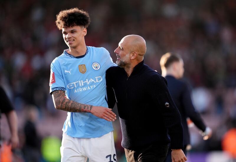 Manchester City manager Pep Guardiola and Nico O'Reilly after the game. Photograph: Adam Davy/PA