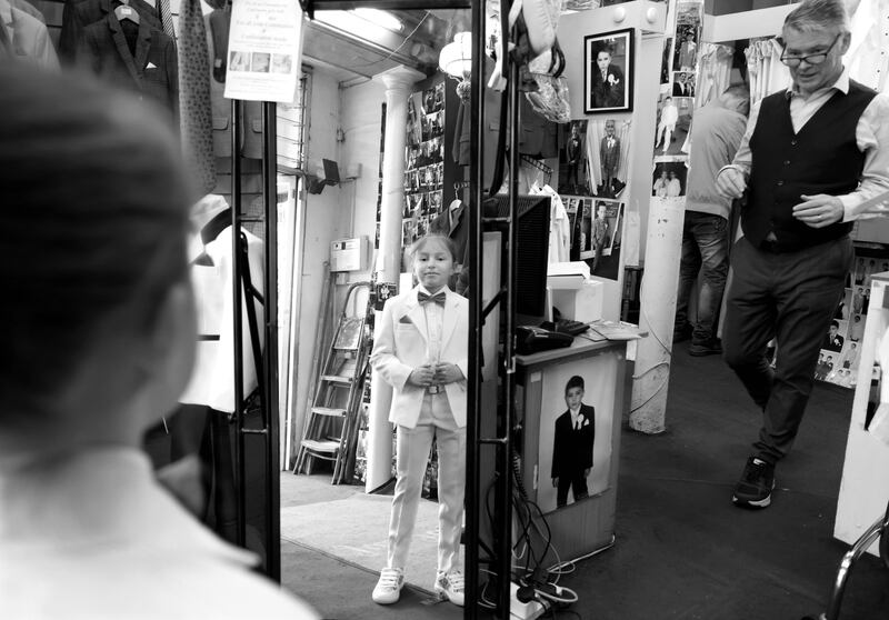 Cherry Cassidy-Kelly (nine) tries on her suit at Jas Fagan Master Tailor Communion Shop on Thomas Street in Dublin. Photograph: Bryan O’Brien