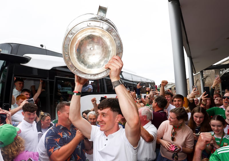 Mayo captain Jack Coyne with the Sam Maguire Cup at Heuston Station, Dublin, on Monday as the All-Ireland champions arrived to catch a train home. Photograph: Grace Halton/Inpho