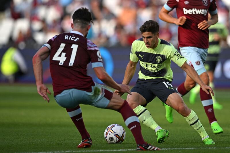 Manchester City's Argentinian striker Julian Alvarez vies with West Ham United's Declan Rice. Photograph: Justin Tallis/AFP via Getty Images 