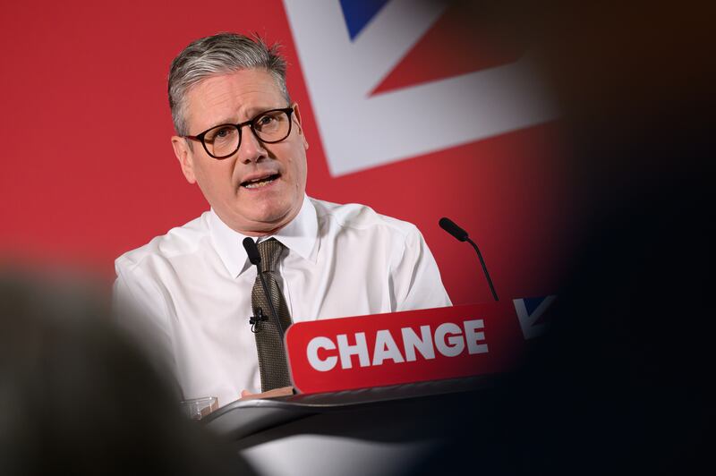 Labour Party leader Keir Starmer addresses party members and media in Lancing Parish Hall, with the Union Jack flag in the background.  Photograph: Leon Neal/Getty Images