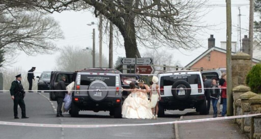 Members of the McGinley-Connors wedding party leave the church in Newtownbutler, Co Fermanagh, after the shooting on Wednesday. Photograph: Ronan McGrade/Pacemaker