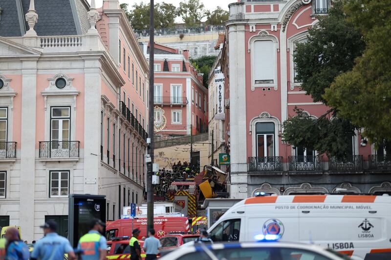 Police and firefighters work at the site of the Gloria funicular crash in Lisbon on Wednesday. Photograph: Patricia De Melo Moreira/AFP