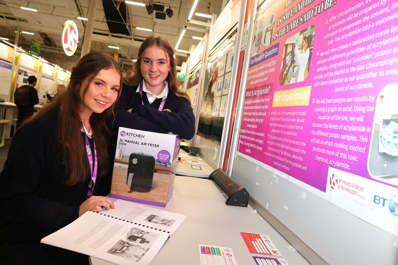 Fourth-years Miriam Finn and Kate McEvoy with their project, Are air-fryers really as healthy we think? The project focused on acrylamide, a substance produced when starchy foods are roasted. Photograph: Dara Mac Dónaill