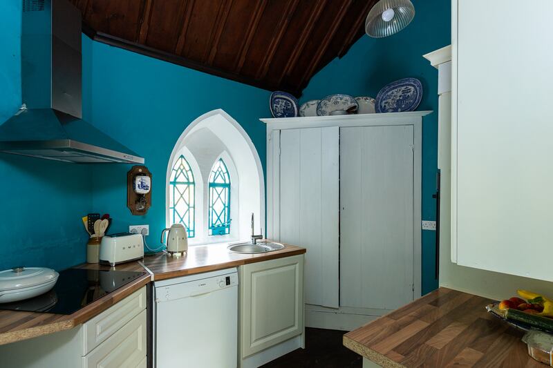 The kitchen is accessed from the rear porch