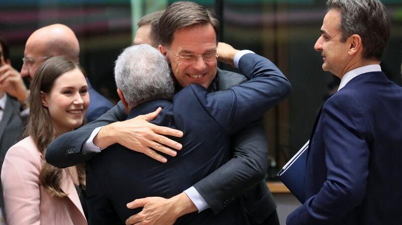 Dutch prime minister Mark Rutte embraces  Portugal’s prime minister António Costa  during the EU budget summit in Brussels. Photograph: Reinhard Krause/Reuters