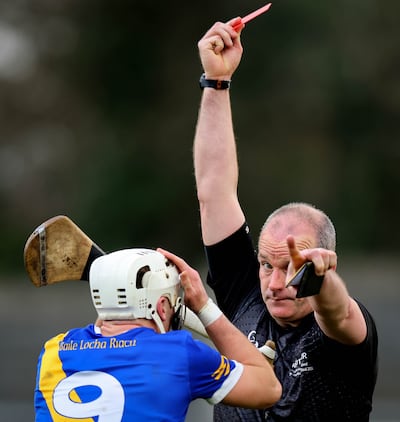 Referee Johnny Murphy shows Loughrea’s Cullen Killeen a straight red card. Photograph: Ryan Byrne/Inpho