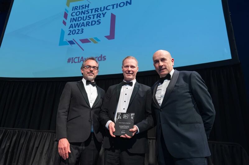 Brian Collentine, director at ORS, presents the green project of the year award to Benjamin Thomas and Ralph Bingham, MOLA Architecture