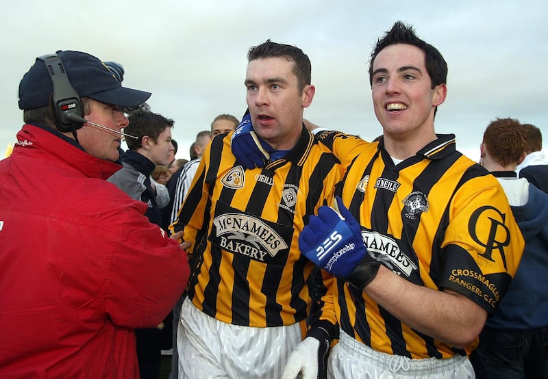 Oisin McConville and Aaron Kernan celebrate Crossmaglen's victory in the 2004 Ulster club football final. Photograph: Lorraine O'Sullivan/Inpho