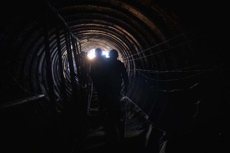 Israeli soldiers and international journalists exit what Israel says is a Hamas tunnel near the Erez border crossing, during an escorted tour by the military for international journalists on December 15th. Photograph: Tamir Kalifa/New York Times
                      