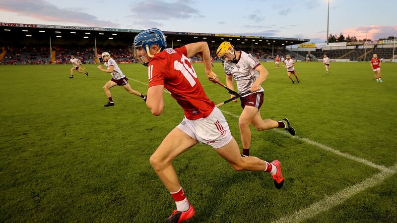 Cork’s Diarmuid Healy bursts clear of Galway’s Nathan Gill during the minor All-Ireland final in Thurles. Photograph:  James Crombie/Inpho