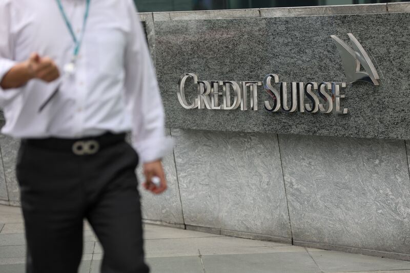 A man walks past Credit Suisse's offices in Hong Kong, China, last week: the bank's assets in Hong Kong made up 0.5 percent of the local banking system's total assets. Photograph: Jerome Favre/Shutterstock