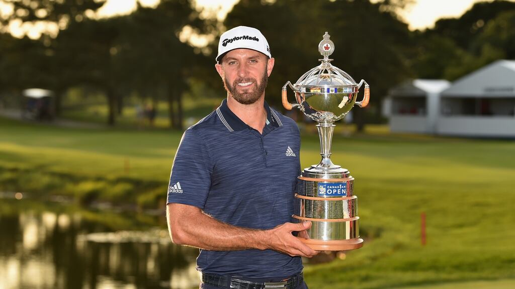 Dustin Johnson with the Canadian Open trophy. Photograph: Minas Panagiotakis/Getty
