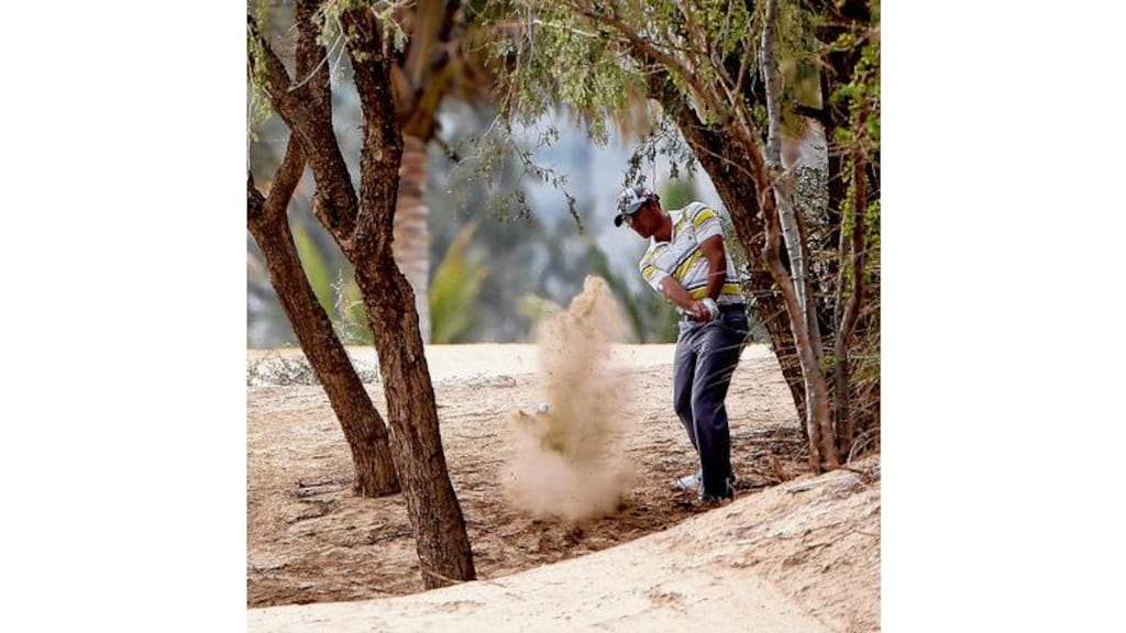 Northern Ireland's Gareth Maybin finds himself a little off course during the second round of the Dubai Desert Classic yesterday. Maybin recovered to sign for a 67 to lie just four shots off the lead. Photograph: Ross Kinnaird/Getty Images