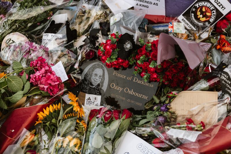  Tributes for Ozzy Osbourne at the Navigation Street mural in Birmingham. Photograph: Joanna Yee/The New York Times
                      