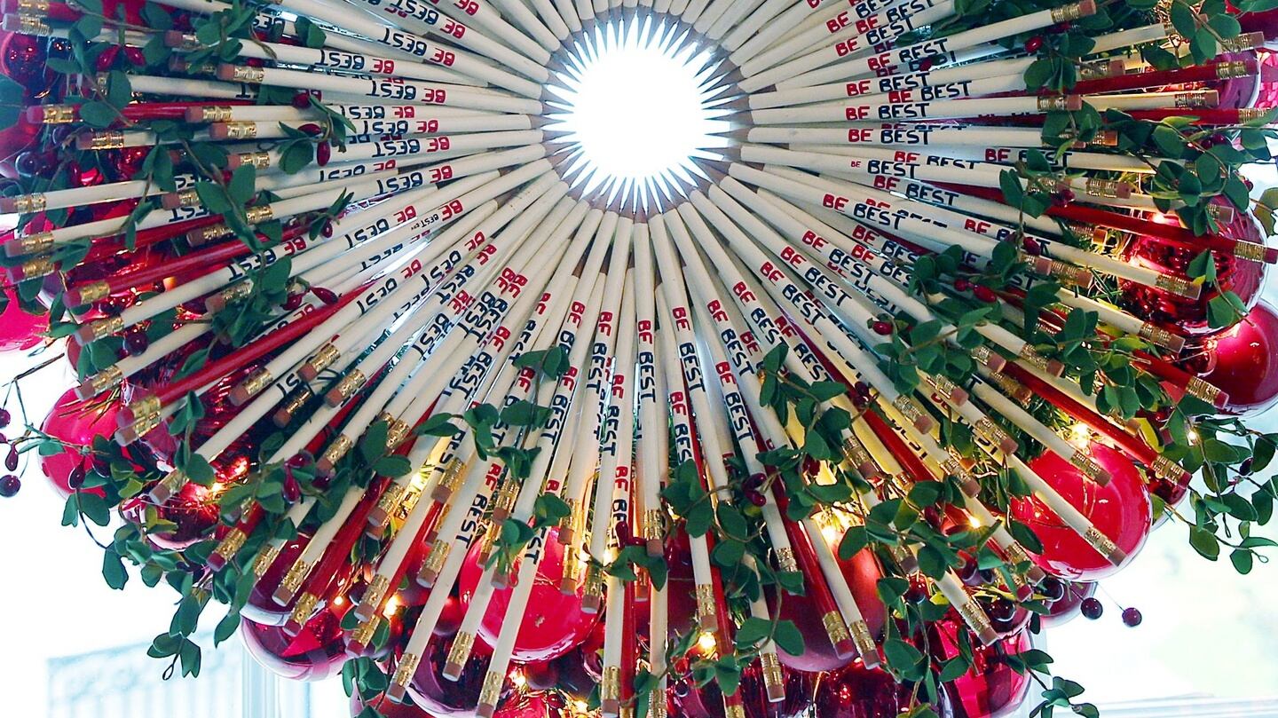 A Christmas wreath made out of ‘Be Best’ pencils hangs in a window of the White House. Photograph: Leah Millis/Reuters