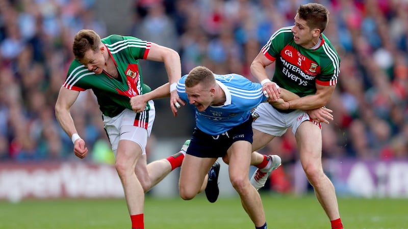 Ciaran Kilkenny battles with Donal Vaughan and Lee Keegan during the 2017 final. Photo: James Crombie/Inpho
