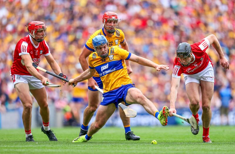 Clare's Shane O'Donnell and Robert Downey of Cork in action. Photograph: Bryan Keane/Inpho