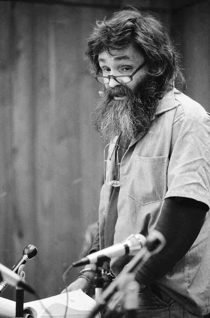 Manson reads a rambling statement at his parole hearing in San Quentin, California. He said he would go to Libya, Iran, South America or France if released. Photograph: AP