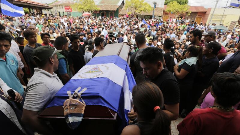 Friends and relatives of Jorge Carrion (33), shot dead during protests against the government of president Daniel Ortega, carry his coffin during the funeral in the city of Masaya. Photograph:  Inti Ocon/ AFP/ Getty Images