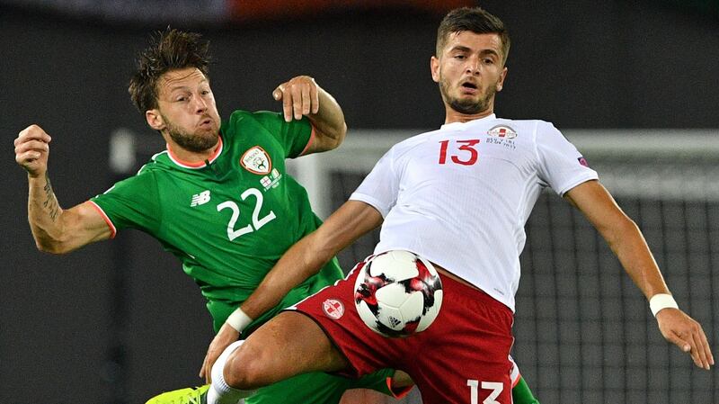 Ireland’s Harry Arter vies with Georgia’s Giorgi Kvilitaia  during the  World Cup group D qualifying match in Tbilisi. Photograph: Mladen Antonov/AFP/Getty Images