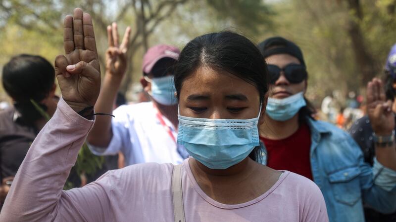 People flash a three-finger salute at the funeral of Ma Kyal Sin, a teenage protester shot dead by security forces, in Mandalay on Thursday. Photograph:  Kaung Zaw Hein