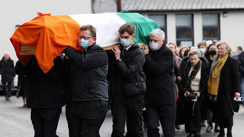 The family of Northern Ireland civil rights activist Austin Curri  follow his coffin into the Church of the Immaculate Conception in Allenwood, Co Kildare for his funeral mass. Photograph: Laura Hutton