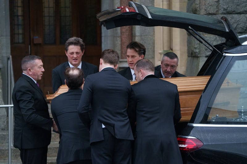 Members of the Costelloe family carry his remains into the church in Monkstown. Photograph: Barry Cronin/ The Irish Times