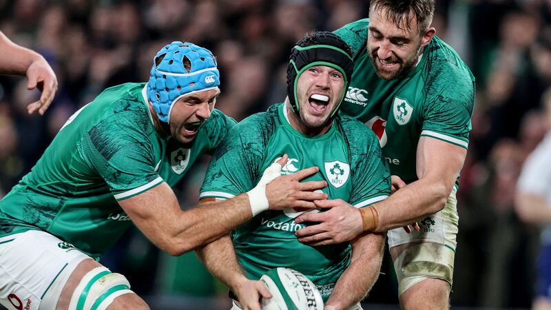 Caelan Doris celebrates after scoring a try with Tadhg Beirne and Jack Conan during the autumn international against New Zealand at the Aviva Stadium. Photograph: Dan Sheridan/Inpho