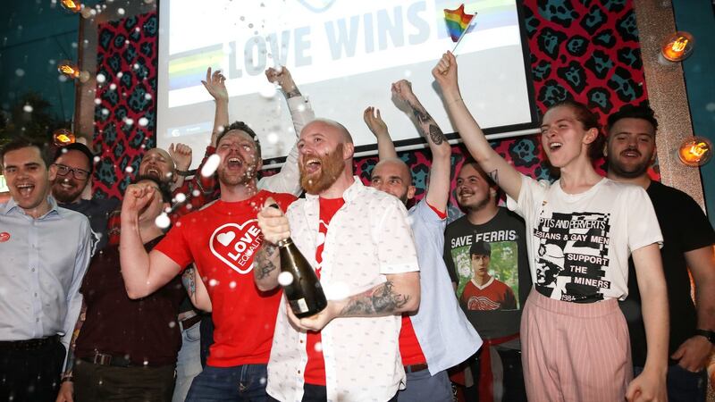 Members of the LGBT community celebrate at the Maverick bar, Belfast, as same-sex marriage in Northern Ireland came a step closer after MPs voted to legalise it if a new Stormont Executive is not formed by October.  Photograph: Peter Morrison/PA Wire