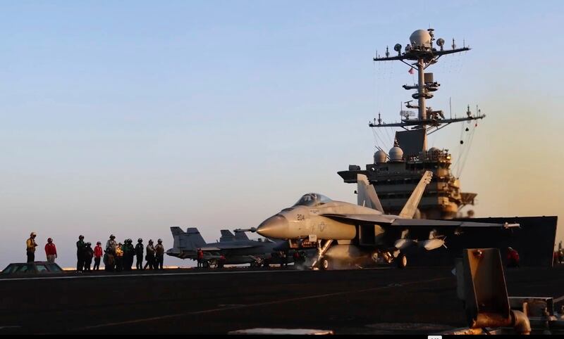 An aircraft launching from the USS Harry S Truman in the Red Sea before airstrikes in Sanaa, Yemen on March 15 (AP)