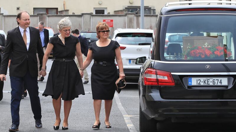 Minister for Children and Youth Affairs Katherine Zappone pictured with her brother in law, Mark Zappone and sister in law, Suzanne Zappone Hoover at An Cosán, Jobstown, Dublin at the wake of her wife   Ann Louise Gilligan. Photograph:  Colin Keegan, Collins Dublin