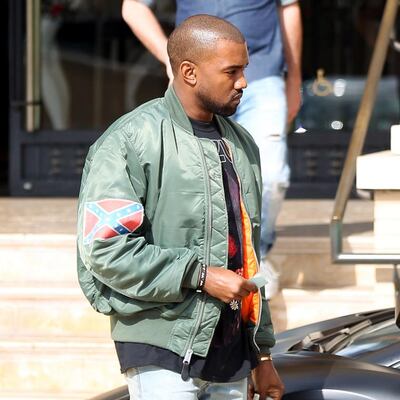 Kanye West in a bomber jacket with a Confederate flag on the sleeve in 2013. Photograph: Bauer-Griffin/FilmMagic/Getty