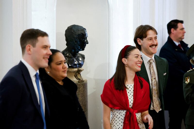 Catherine Connolly's sons Brian McEnery (left) with his partner, and Stephen McEnery (right) with his partner attend their mother's inauguration. Photograph: Clodagh Kilcoyne/Pool