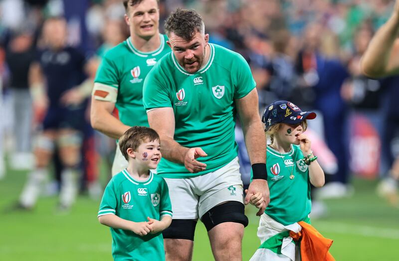 Ireland’s Peter O’Mahony celebrates with his son Theo and daughter Indie after the game. Photograph: Billy Stickland/Inpho 