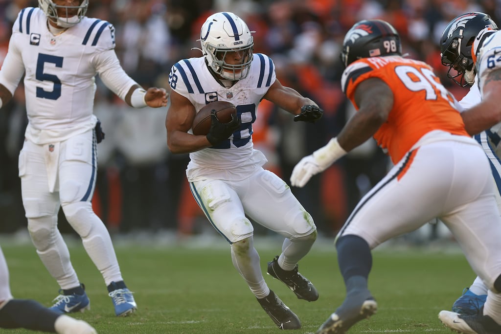 Jonathan Taylor of the Indianapolis Colts carries the ball against the Denver Broncos. Photograph: Matthew Stockman/Getty Images