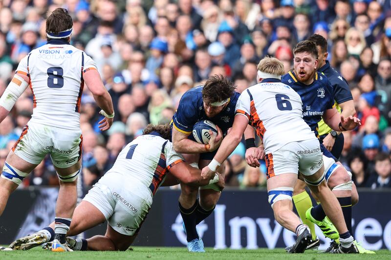 Leinster's Ryan Baird is tackled by Pierre Schoeman and Liam McConnell of Edinburgh during last Sunday's Champions Cup round of 16 at the Aviva Stadium. Photograph: Ben Brady/Inpho