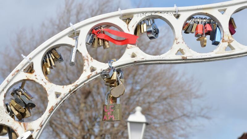 Love locks on the Ha’Penny Bridge:  Emails show Dublin City Council has considered erecting a sculpture on the quays to attract the locks away. Photograph: Alan Betson