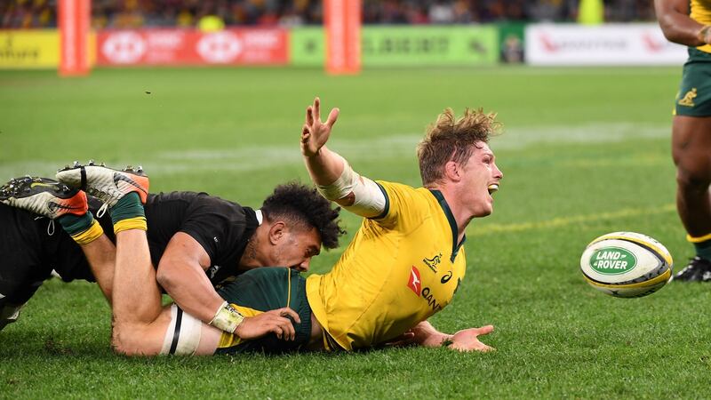 Ardie Savea of the All Blacks tackles Michael Hooper during the match in Perth. Photograph: EPA